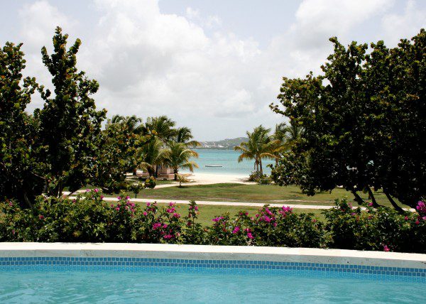 Poolside view from a Rosewood Estate Suite at Jumby Bay