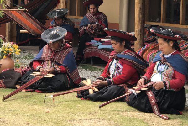 Learning about traditional weaving techniques in Chinchero