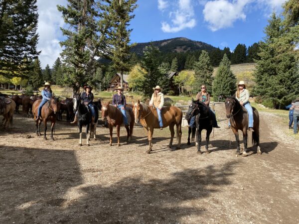 a group of people horseback riding
