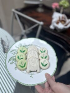 Here's an alt tag for the image: Decorated cookies on a plate.