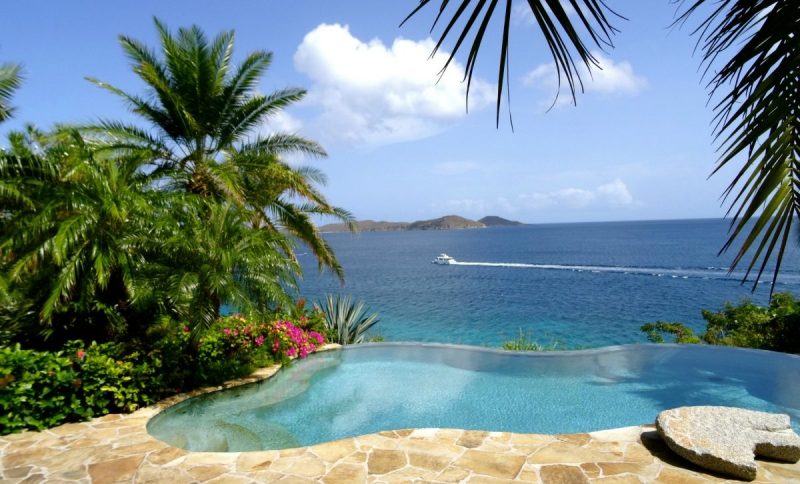 A swimming pool overlooking the ocean.